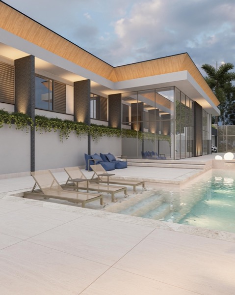 Fachada e piscina da Casa Ipê Branco com novo beiral iluminado